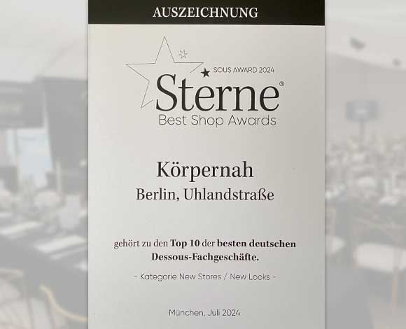 Urkunde "Sterne Best Shop Award" für das Geschäft Körpernah Berlin in der Uhlandstraße.